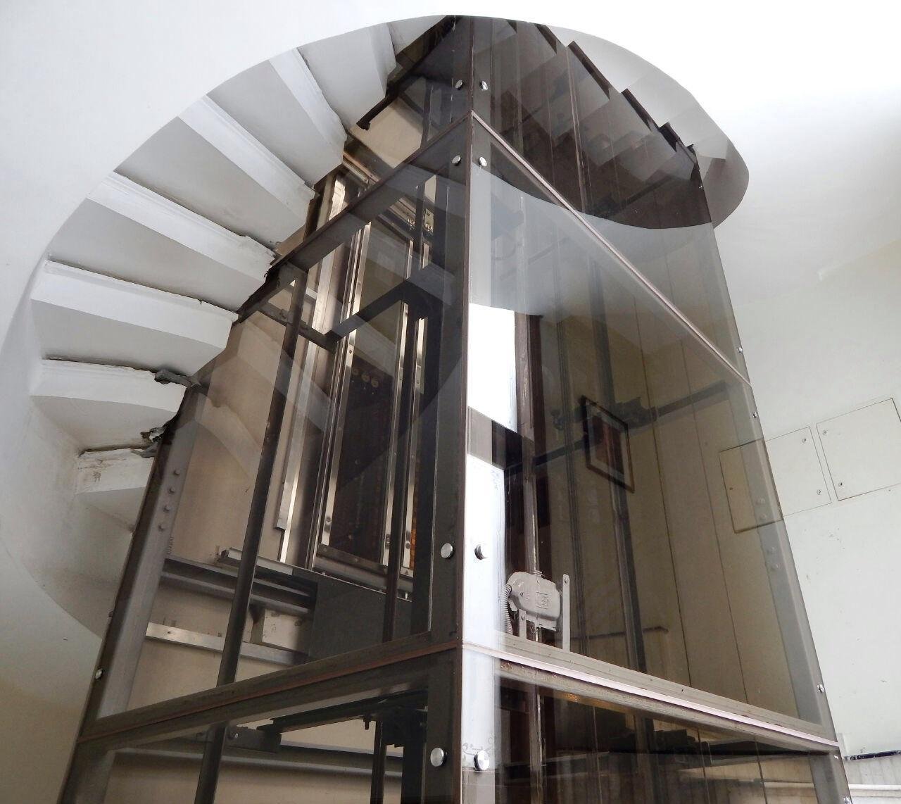 Curved Staircase Integrated Glass Cabin